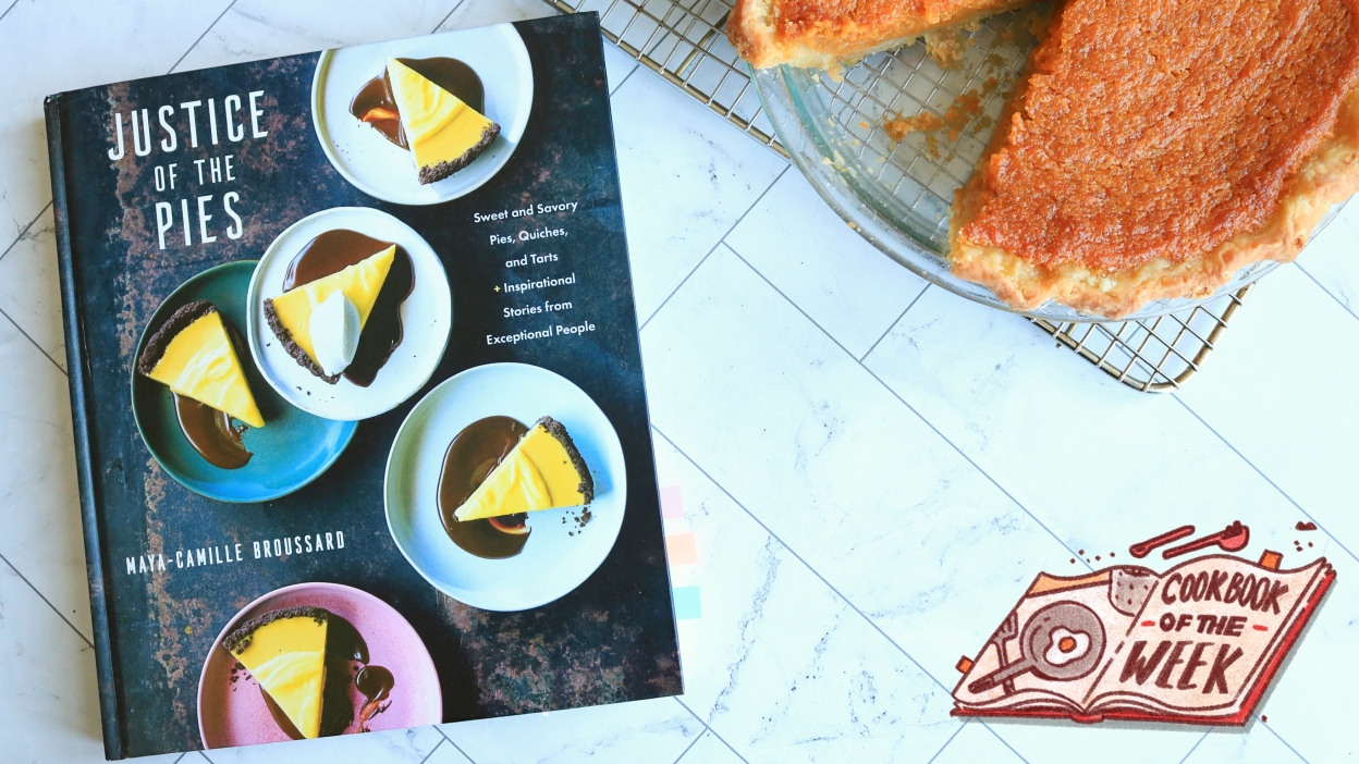 Justice of the Pies cookbook next to a sweet potato pie.