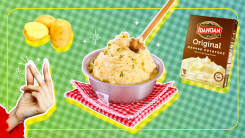 A hand snapping fingers next to a plate of mashed potatoes.