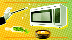 A magician's hand and wand tapping a microwave with peas and potatoes floating in front.