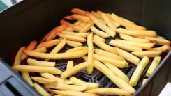 french fries cooking in an air fryer