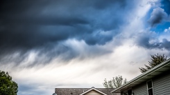 Storm clouds over suburban home