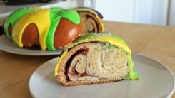 A slice of king cake on a plate.