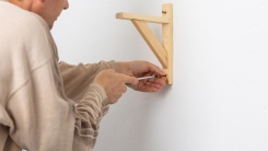 Man hanging a shelf