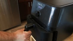 A person pulling open an instant vortex air fryer.