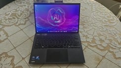 The MSI Prestige 13 AI+ EVO laptop open on a table displaying the desktop.