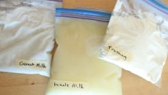 A zip-top bag of milk, coconut milk, and vanilla frosting.