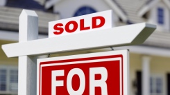 "Sold" sign outside home