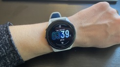 Beth's wrist with a Garmin Forerunner 265.