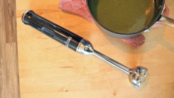All-Clad stick blender on a counter top.