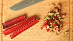 Sliced rhubarb on a cutting board.