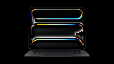 A photo of the M4 iPad Pro with a Magic Keyboard attached, against a black background.