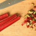 Sliced rhubarb on a cutting board.