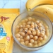 Bob's Red Mill egg replacement next to a bowl of chickpeas in aquafaba and a few bananas.