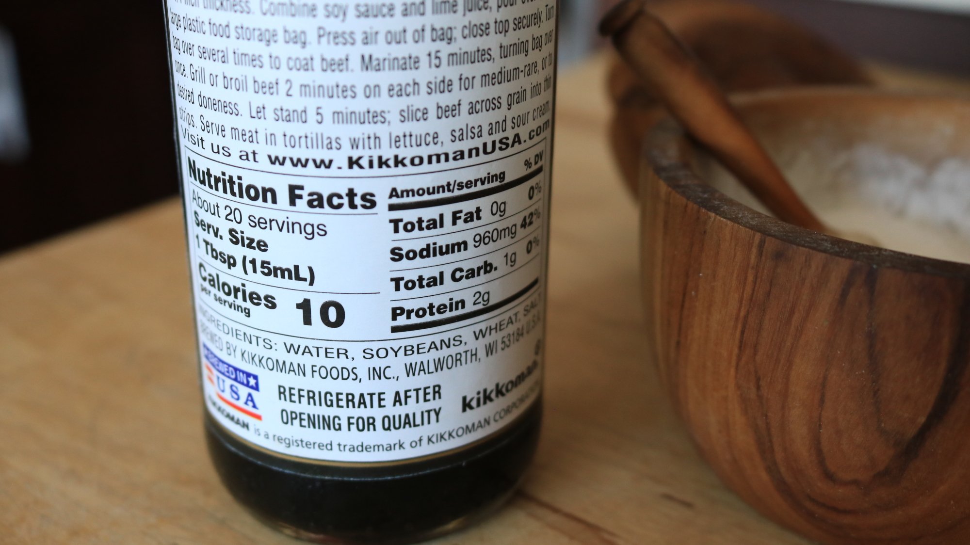 Nutrition facts label on Kikkoman soy sauce bottle.