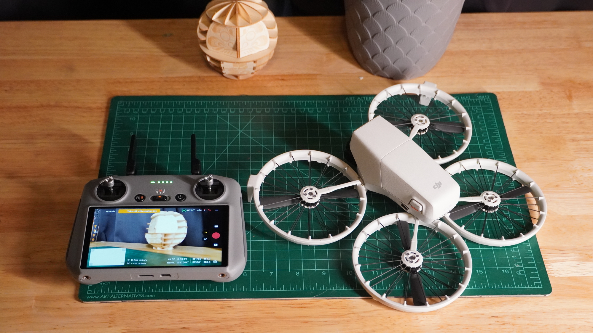 DJI Flip on a desk with the camera turned on
