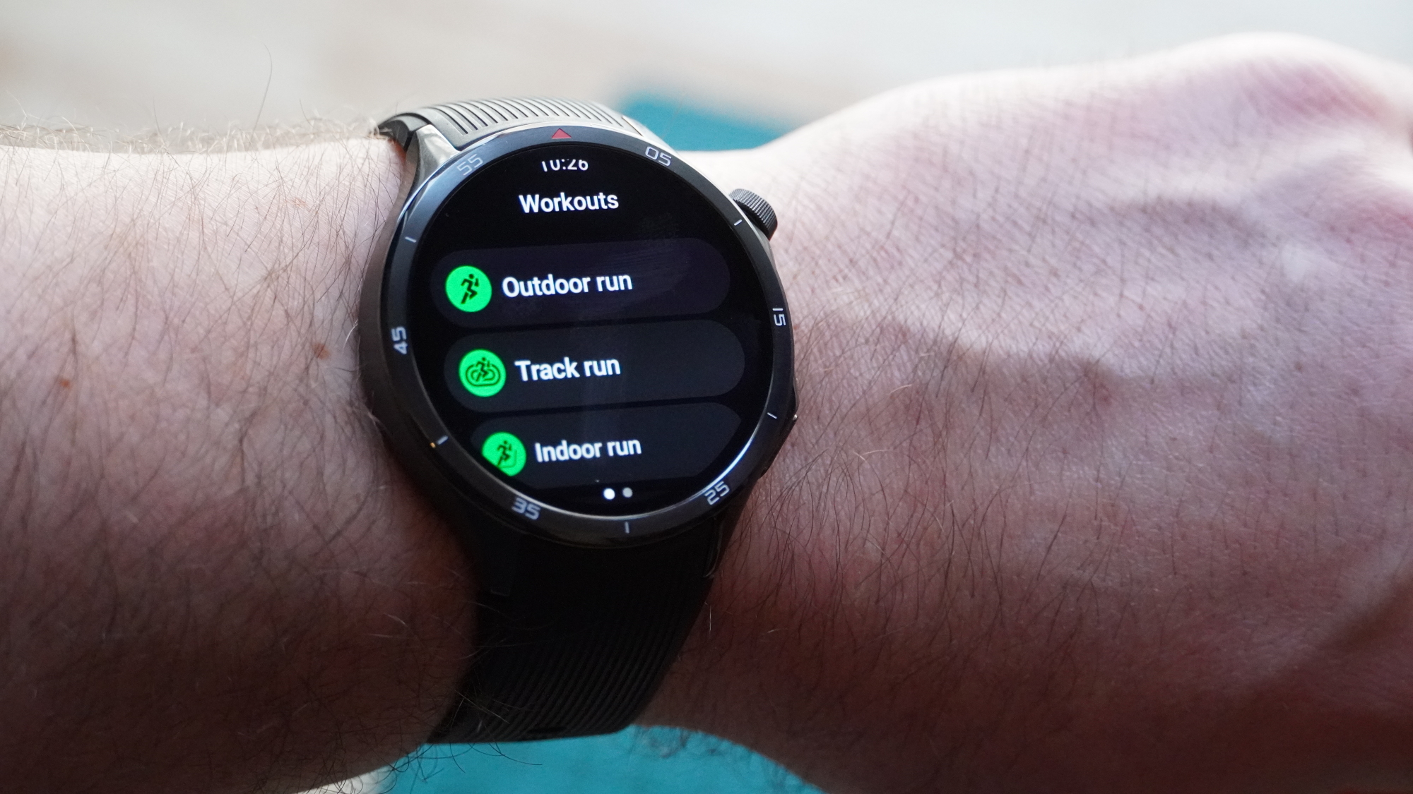 OnePlus Watch 3 on a wrist showing fitness tracking