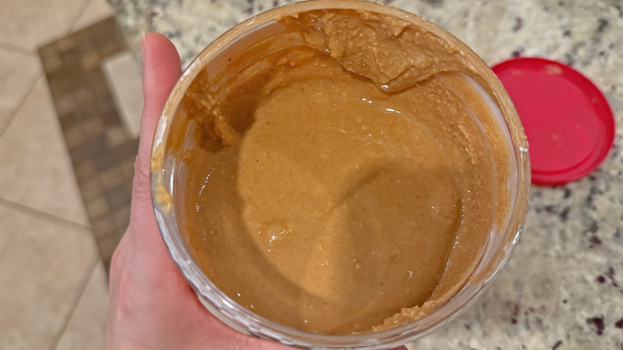 Peanut butter in a plastic container.