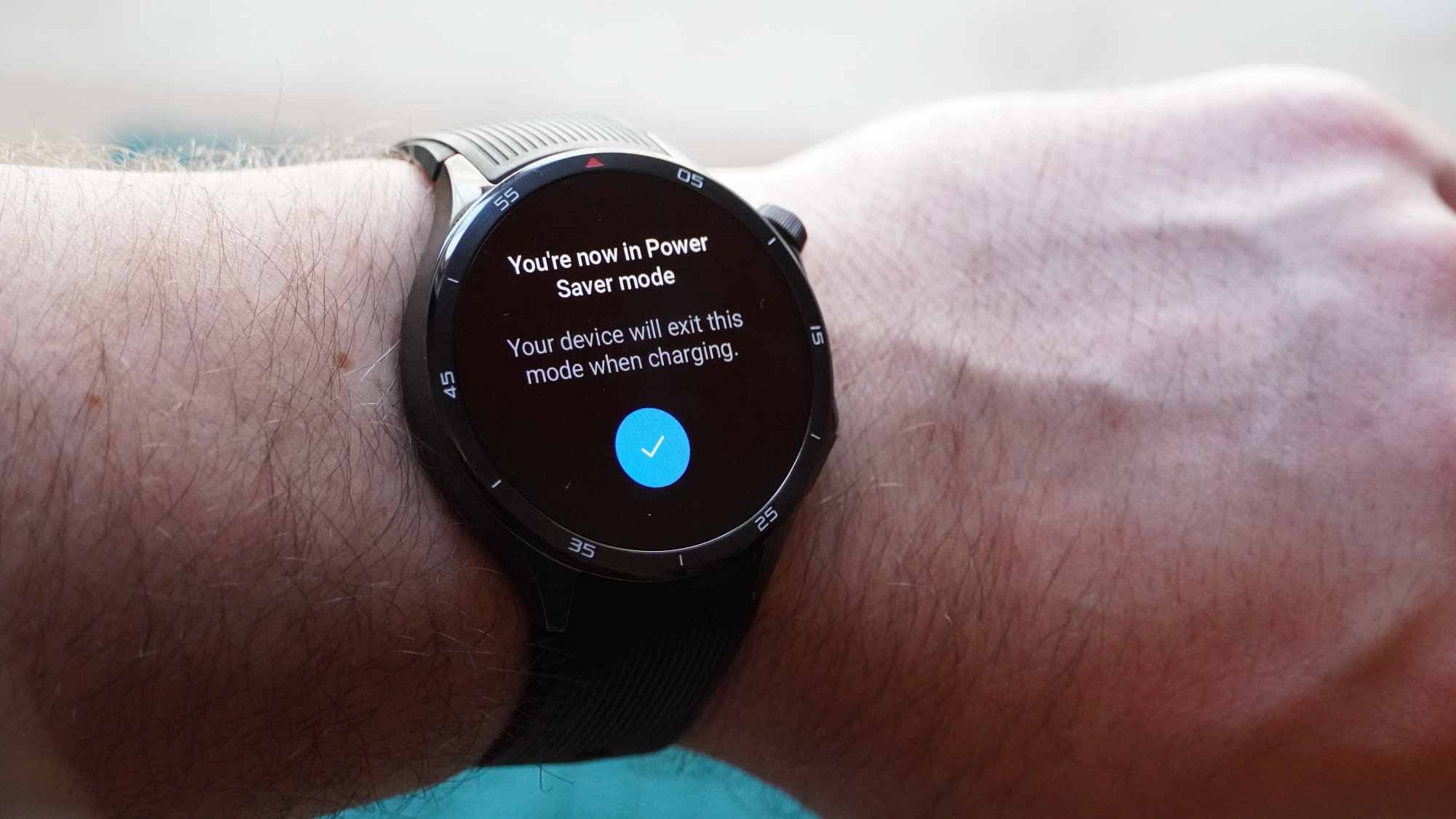 OnePlus Watch 3 on a wrist showing Power Saver mode