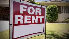 A for rent sign in front of a house