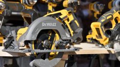collection of DeWalt power tools on a workbench