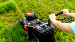 person mowing a lawn