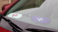 Closeup of a Lyft sticker on a rideshare vehicle