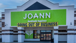 Exterior of a Joann Fabric and Crafts store with a "going out of business" sign