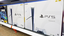 PlayStation 5s on a shelf in a store