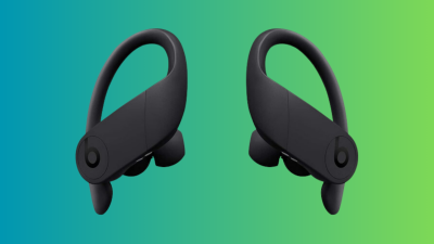 Beats Powerbeats Pro earbuds on a teal and green gradient background.