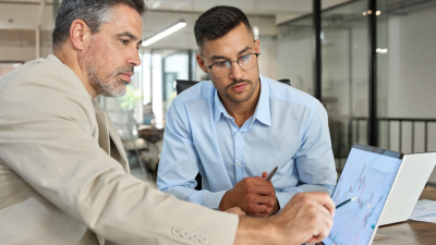 Two investors doing financial trading market data analysis.