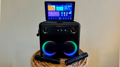 The Break X2 karaoke machine on a stool.