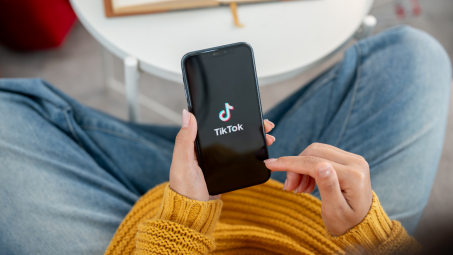 person using tiktok app on a smartphone