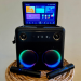 The Break X2 karaoke machine on a stool.