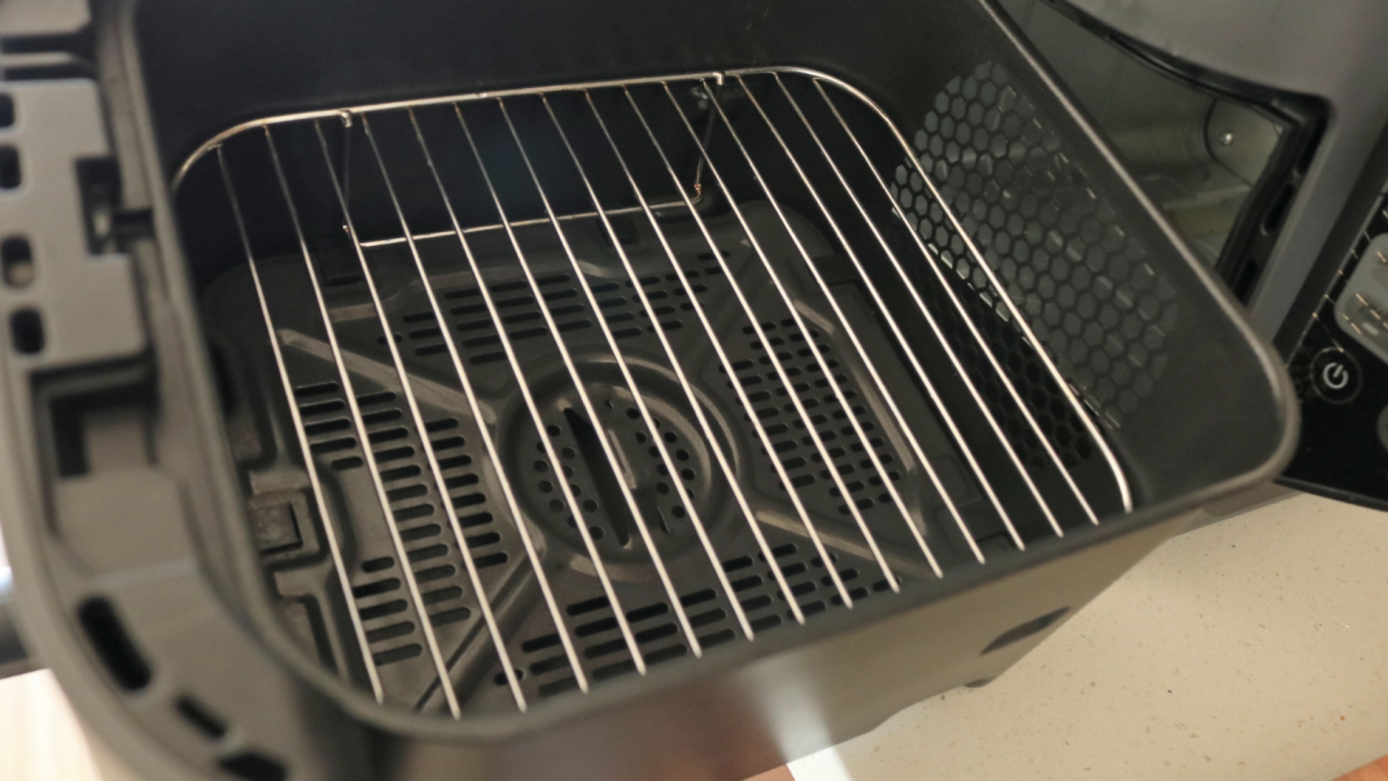 The inside of the Ninja DoubleStack's air fryer basket.